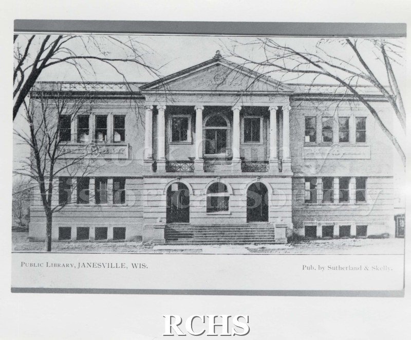 Black and white photograph of the Janesville Public Library. On bottom: "Public Library, Janesville, Wis. Pub.by Sutherland & Skelly".