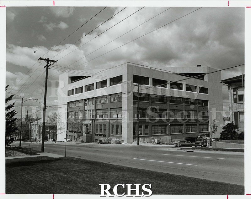 Black and white photograph of Parker Pen Company building on Court Street during construction project to update the exterior of the building.