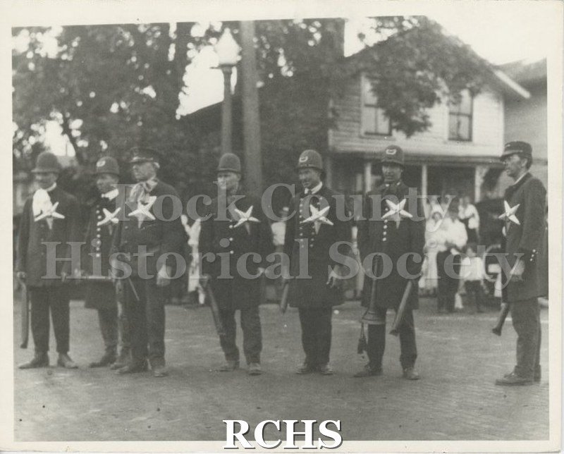 Black and white photograph of Janesville police officers in Nonesuch Brothers Circus event.