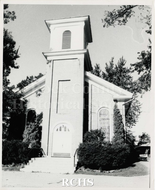 Black and white photograph of Fulton Congregational Church United Church of Christ. Shows front of church with front door on bottom of bell tower.