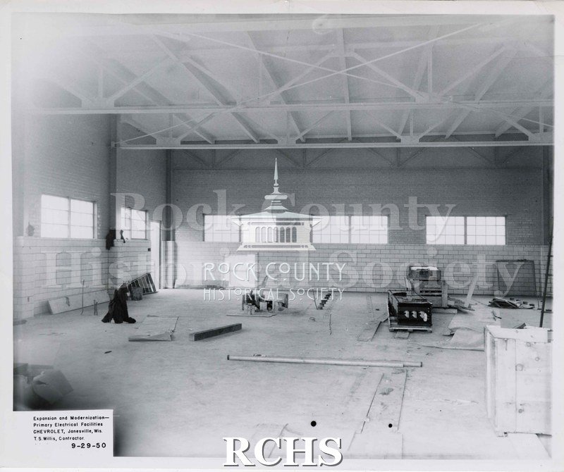 Black and white photograph of the construction of the inside of Chevrolet building.