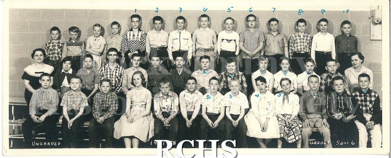 Black and white photograph of the fifth and sixth grades of an Edgerton school taken 1957-58. There are three rows of students, top two of 14 and one of 13.
