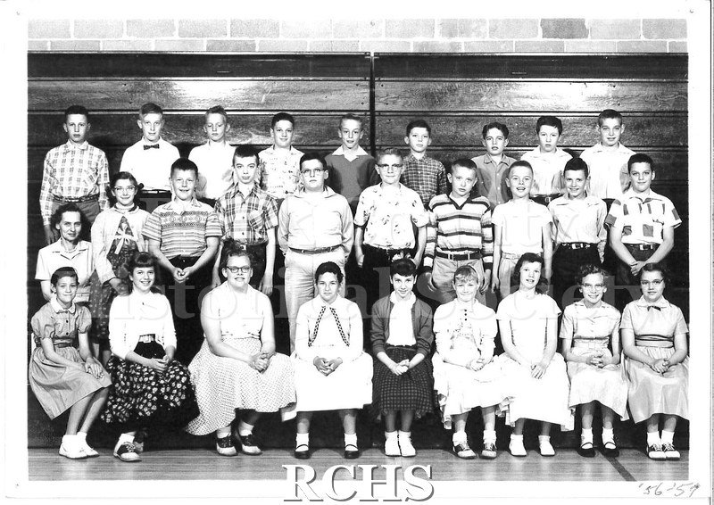 Black and white photograph of Edgerton school children for the school year 1956-57. There are three rows of 9, 10, and 9.