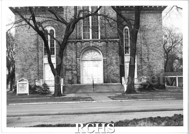 Black and white photograph of the front of the original building for the First Congregational Church.