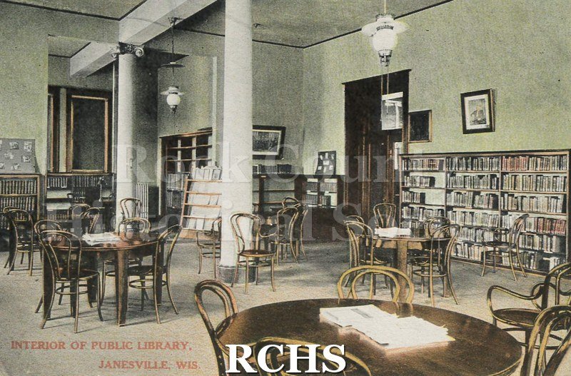 Postcard. Tinted image of the interior of the Janesville Public Library.