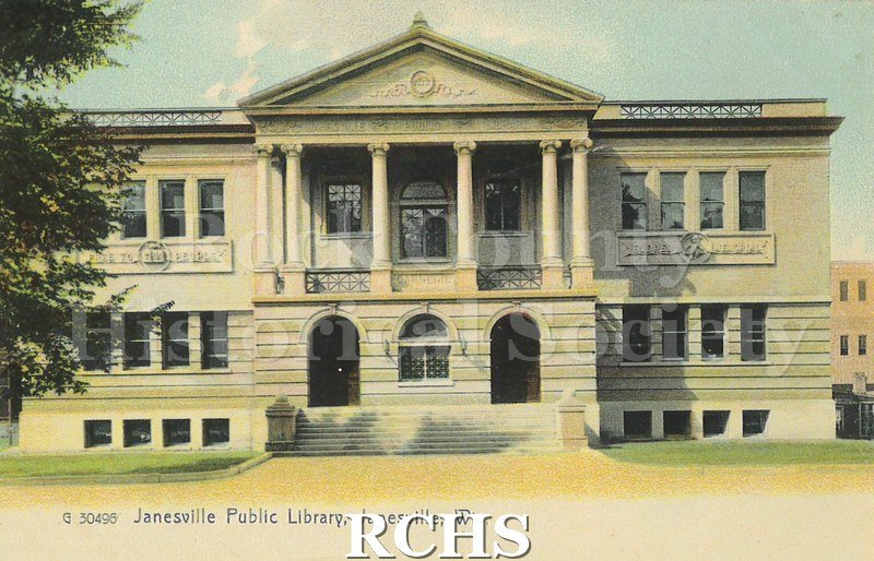 Postcard. Tinted image of the exterior of the Janesville Public Library. Card is addressed to Miss Elsie Ott, 1315 Main Street. No postmark.