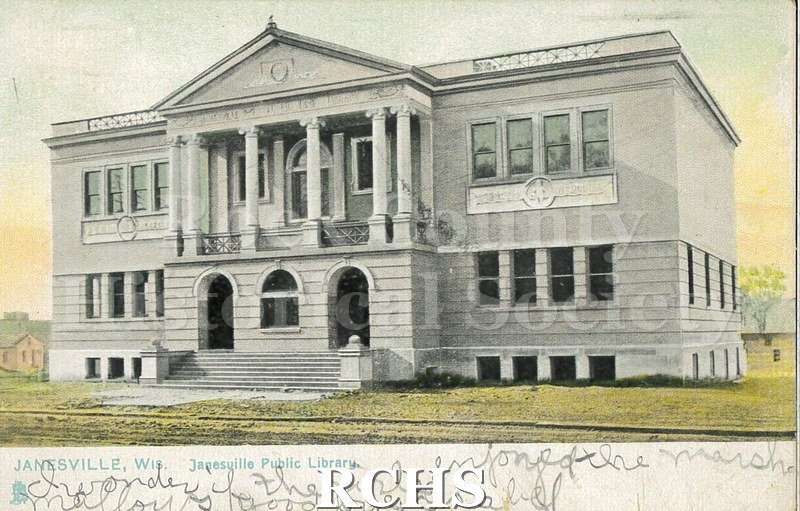 Postcard. Tinted image of the exterior of the Janesville Public Library. Addressed to Miss Helen McLay in Milton. Postmarked November 7, 1908.