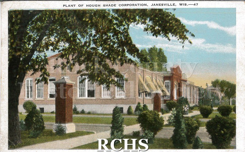 Postcard. Colorized image of the exterior of the Hough Shade Corporation in Janesville. Postcard is addressed to Misses Grayce & Myrtle Didriksen in Chicago.