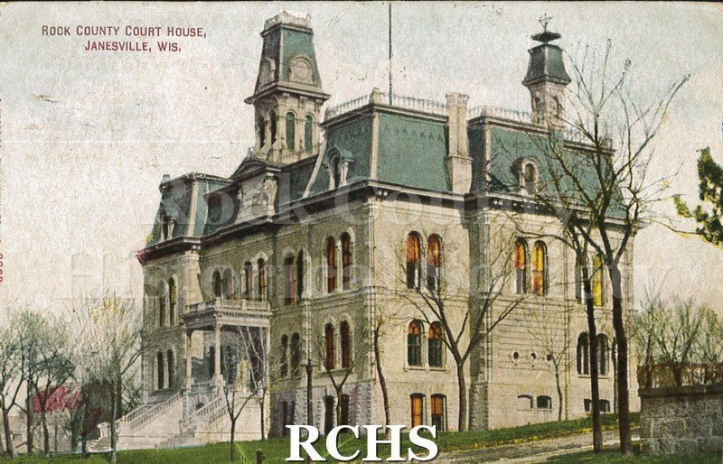 Postcard. Colorized image of the exterior of the Rock County Court House. Postcard is addressed to Miss Hattie Kopp in Chicago. Postmarked Feb. 9, 1914.
