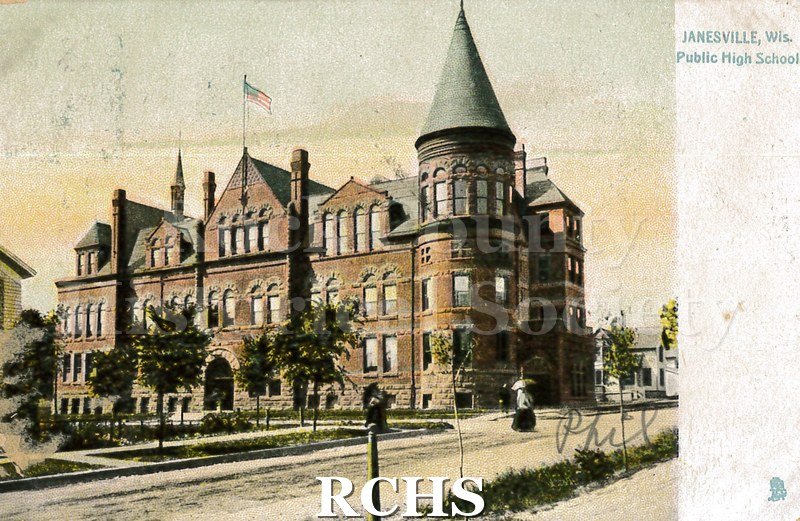 Postcard. Colorized image of the exterior of the Janesville High School. Description on back reads: "The Public High School was erected in 1895.