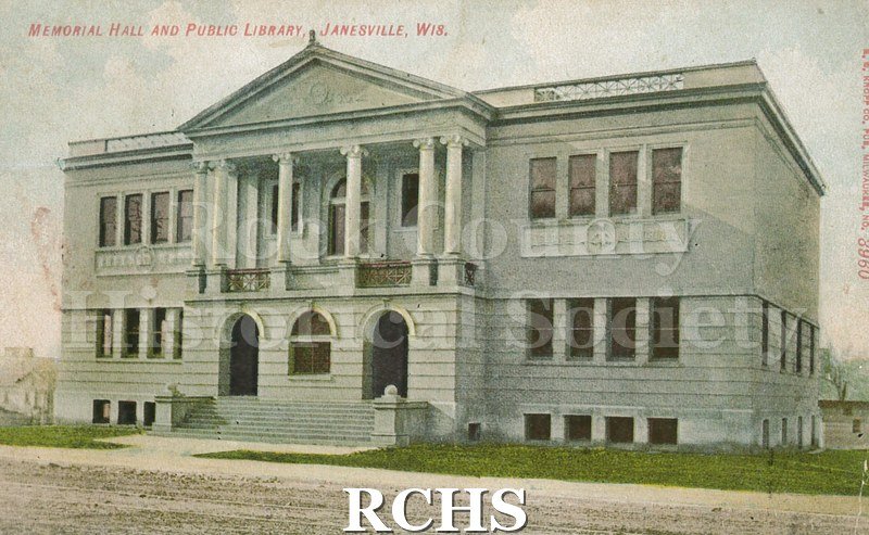 Postcard. Exterior view of the Memorial Hall and Public Library in Janesville. Postcard is addressed to Mr. Emil C. Malmbery in St. Louis.