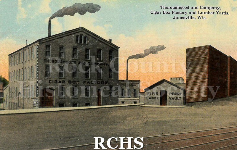Postcard. Tinted image of the exterior of the Thoroughgood and Company Cigar Box Factory in Janesville.
