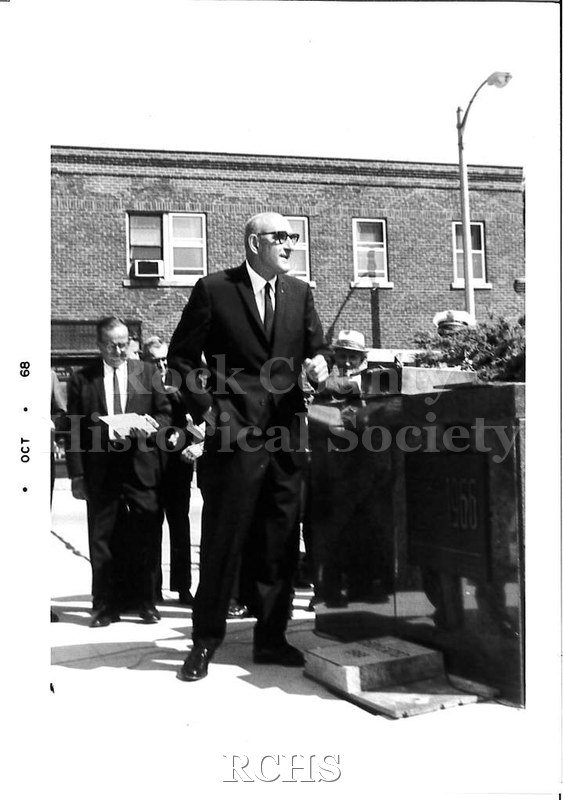 Black and white photograph of Joseph Lustig who is the older man standing next to the dedication slab.
