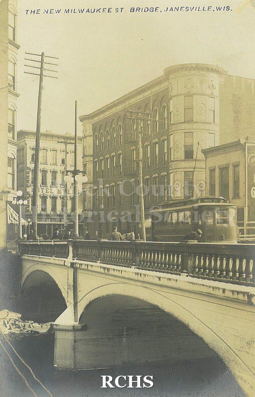 Postcard. Black and white photograph of the new Milwaukee Street Bridge, which was necessary to construct due to the April 1913 fire.