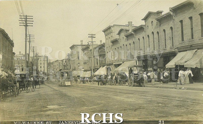 Postcard. Black and white photograph of Milwaukee Street in Janesville.
