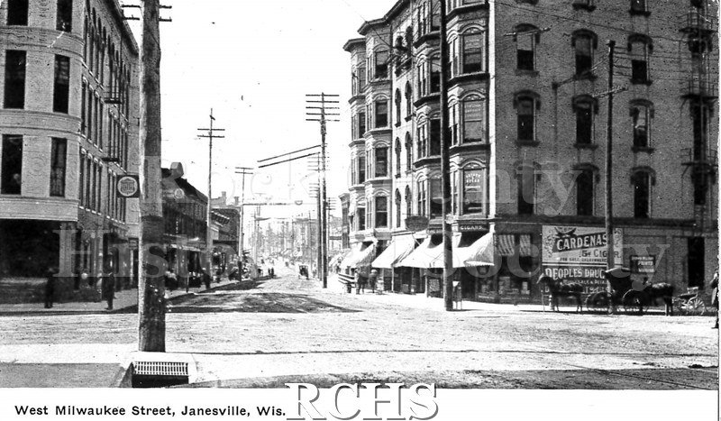 Postcard. Black and white photograph of West Milwaukee Street in Janesville.