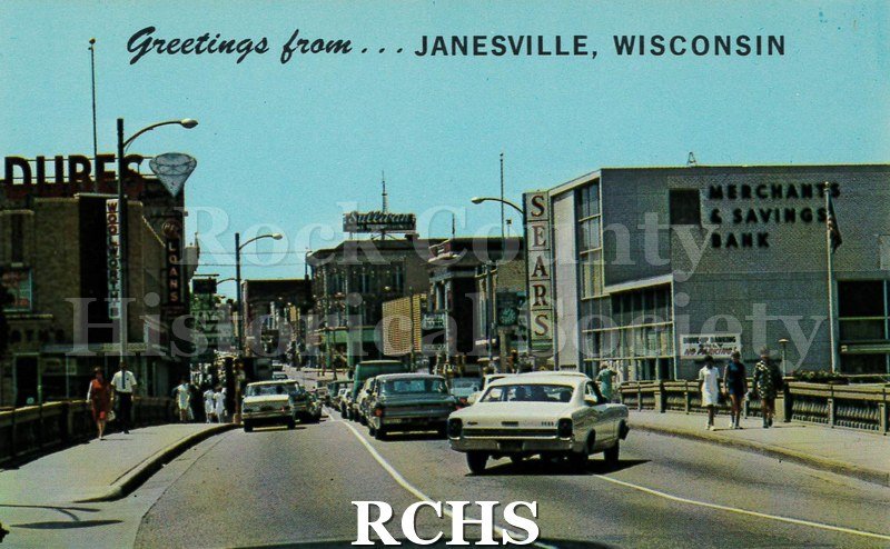 Postcard. color photo of West Milwaukee Street in Janesville.