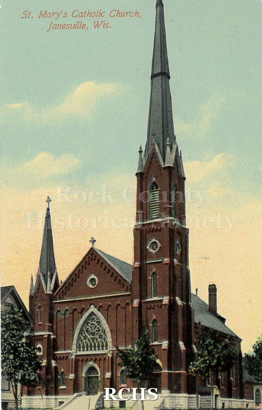Postcard. Tinted image of the exterior of St. Mary's Catholic Church in Janesville. Postmarked 24 September 1906 and addressed to Emma Schless of Watertown.