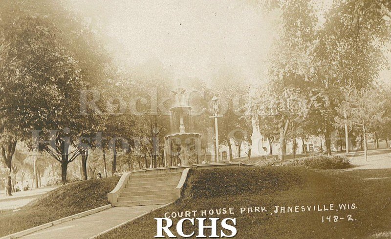 Postcard. Sepia-toned photograph of the fountain at Court House Park in Janesville.