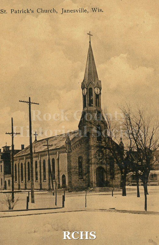 Postcard. Black and white image of the exterior of St. Patrick's Church in Janesville. Postmarked December 1907. Addressed to Miss S.M. Porter of Racine.