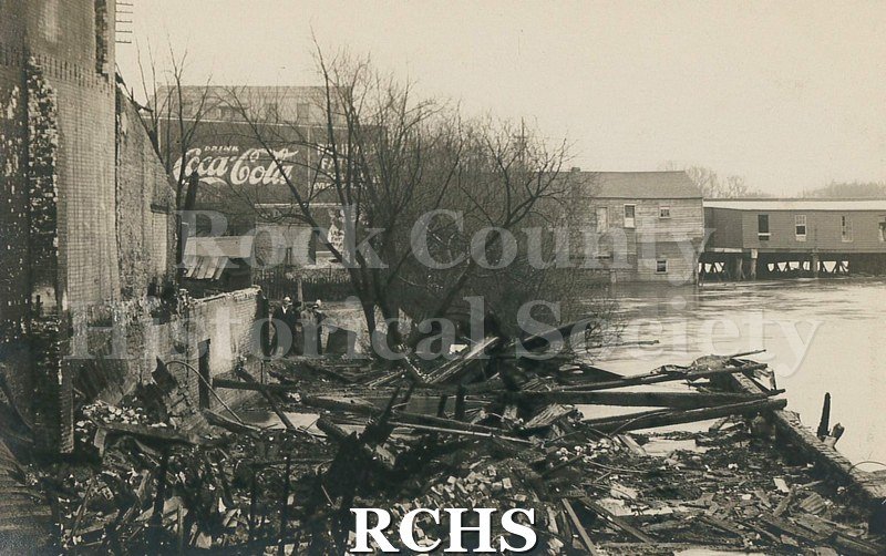 Postcard. Black and white photograph of the wreckage after the Milwaukee Street fire in April 1913.