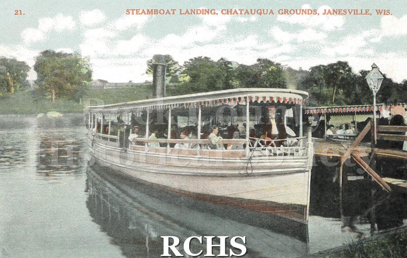 Postcard. Tinted image of individuals arriving to the Chautauqua Grounds in Janesville in a steamboat.
