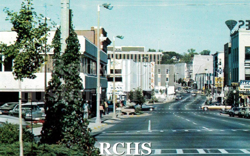 Postcard. color photo of Main Street in Janesville.
