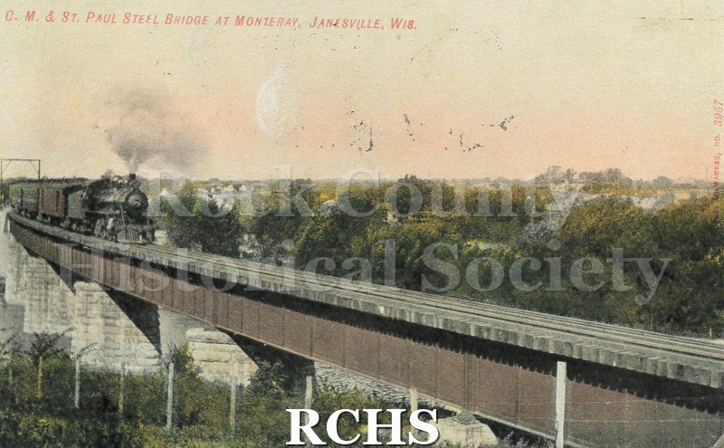 Postcard. Tinted image of the Chicago, Milwaukee & St. Paul Railroad bridge. Addressed to Kittie McCullock of Madison. Postmarked 29 August 1908.