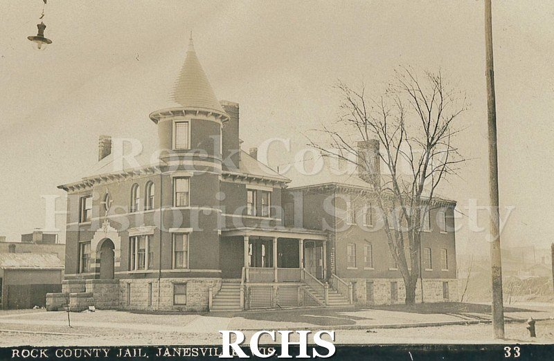 Postcard. Black and white photograph of the exterior of Rock County Jail in Janesville.