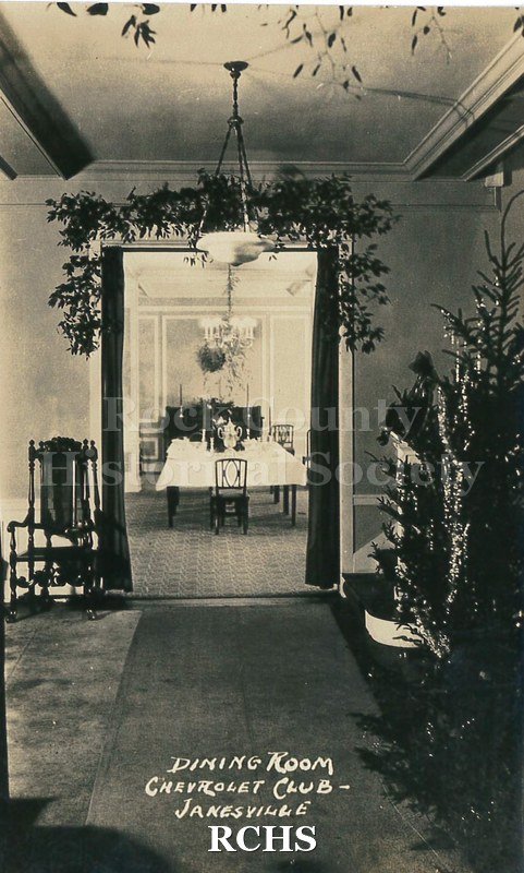 Postcard. Black and white photograph of the dining room at the Chevrolet Club in Janesville.