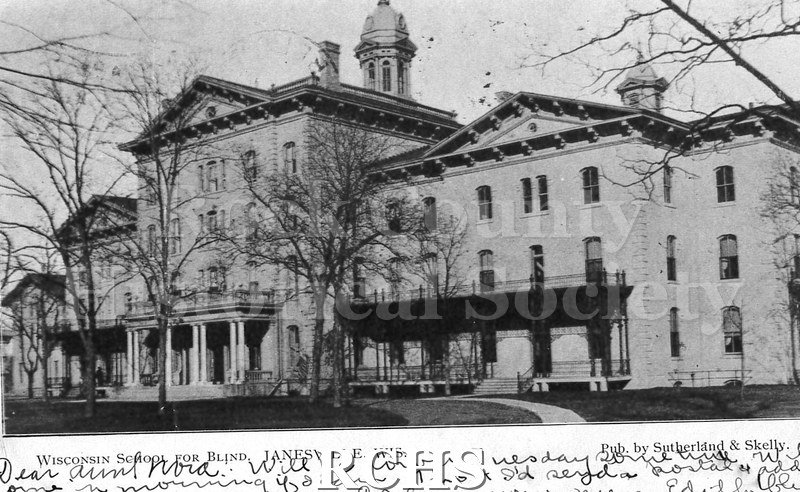Postcard. Black and white photograph of the exterior of the Wisconsin School for the Blind. Addressed to Nora [illegible] of Beloit. Postmarked 2 February 1906.