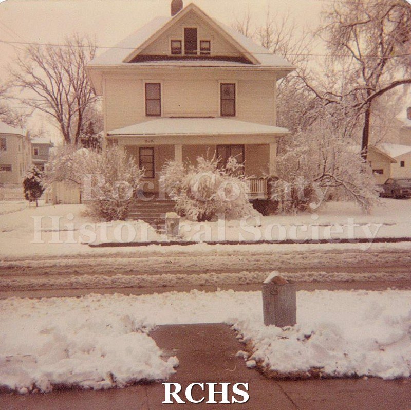 Black and white photograph of the Botsford House, 310 N. Terrace St., Janesville, WI. Shows a three story house with snow on the ground.
