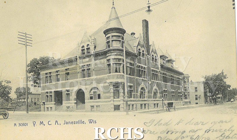 Postcard. Black and white image of the Y.M.C.A. building in Janesville. Addressed to Mr. Will Libbey of Rochester, Minnesota. Postmarked 17 August 1910.