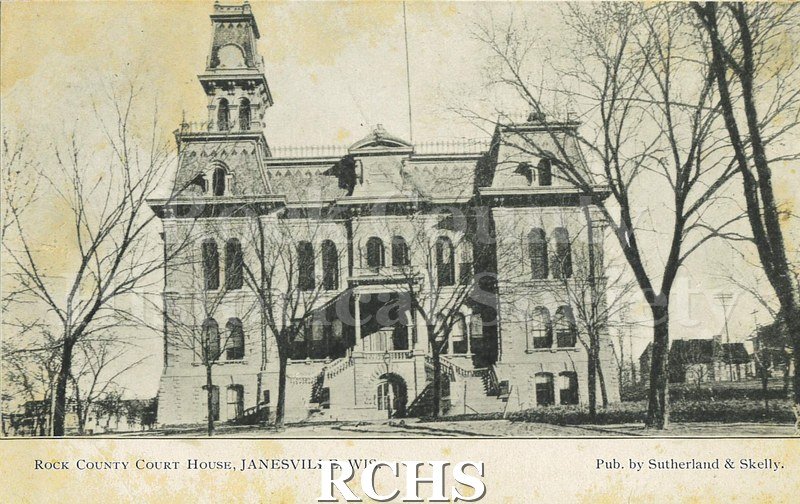 Postcard. Black and white photograph of the Rock County Court House. Addressed to Clara Brigham of Hebron, Illinois. Postmarked 4 October 1909.