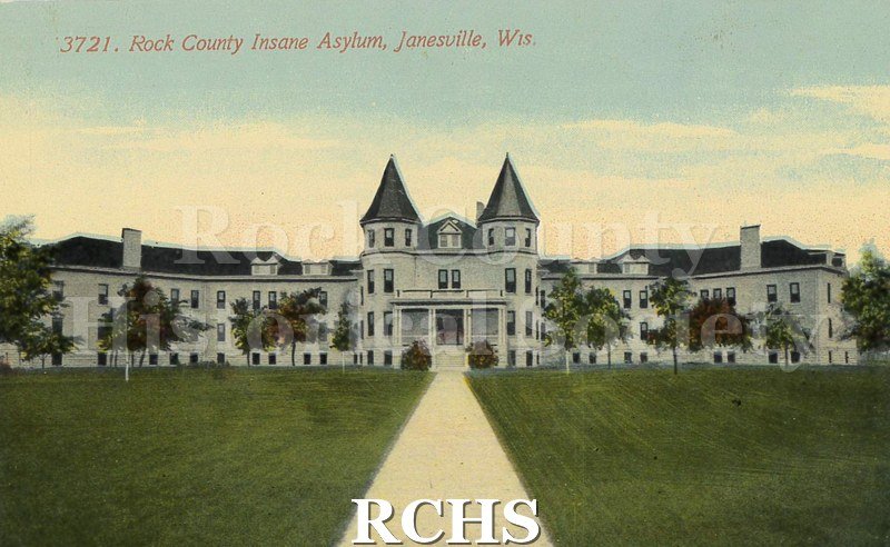Postcard. Tinted image of the exterior of the Rock County Asylum in Janesville.