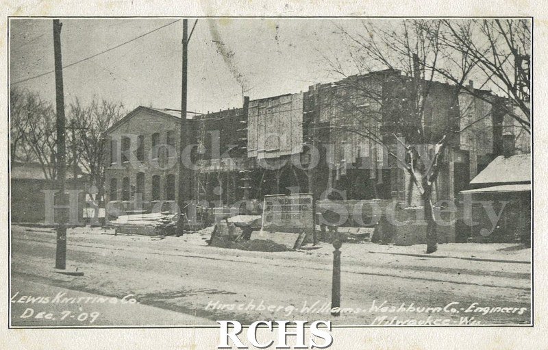 Postcard. Black and white image of the exterior of the Lewis Knitting Company in Janesville on 7 December 1909.