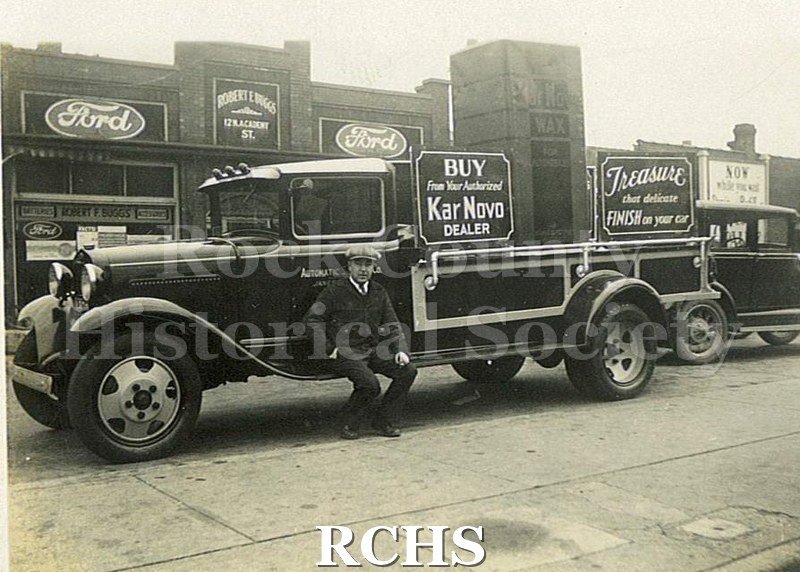 Black and white photograph of sign for Kar Nova Dealer.