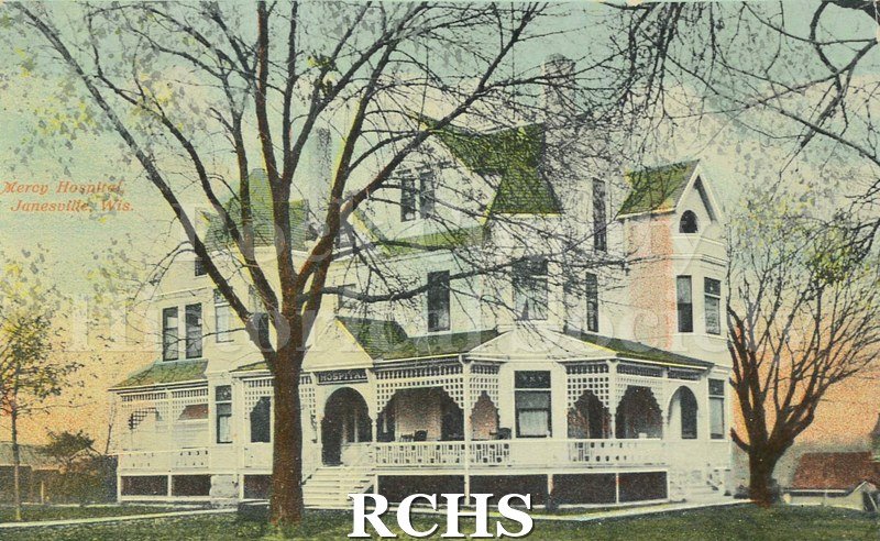 Postcard. Tinted image of Mercy Hospital. Addressed to L. Hall of Greenfield, California. Postmarked 23 August 1911. Message written in black ink: "221 Court St.