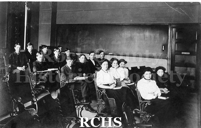 Postcard. Black and white image of students at Janesville High School, Class of 1907. A.W. Dunwiddie is in the back row on the left.