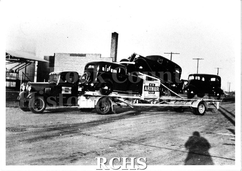 Black and white photograph of a W. R. Arthur & Co. trucking rig. A truck cab with the W. R.
