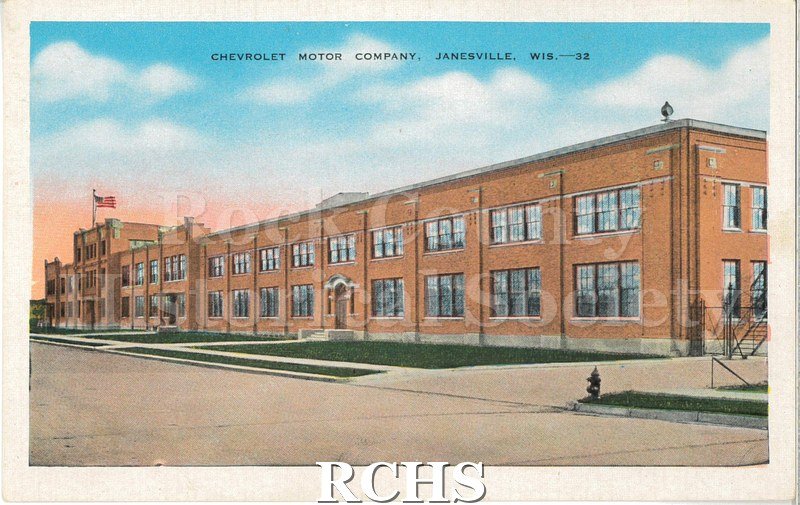 Postcard. Postcard with a color print of the Chevrolet Motor Company plant in Janesville. The brick facade of the plant is pictured, facing left.