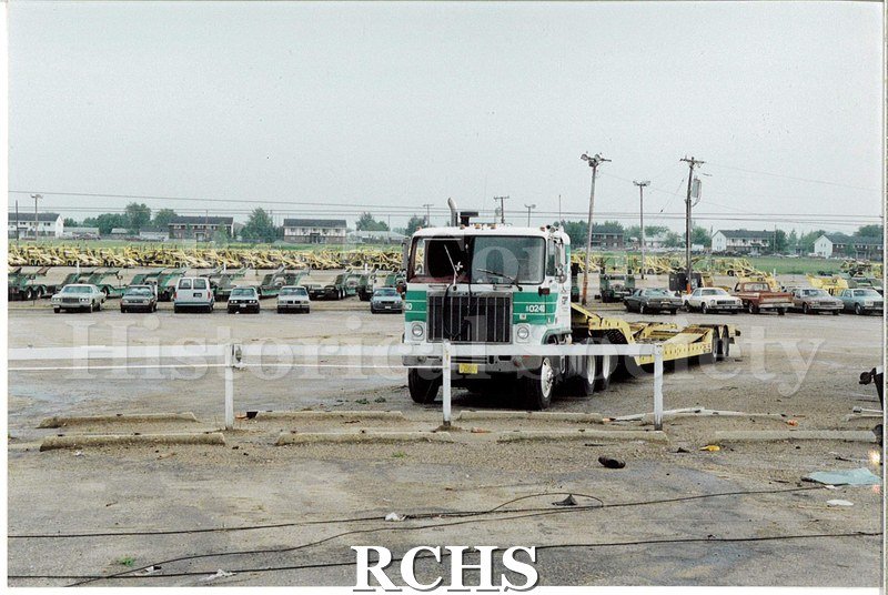 Color photo of the damage to the Janesville Terminal from the 1991 tornado. The photo is outside, and shows a transport truck.