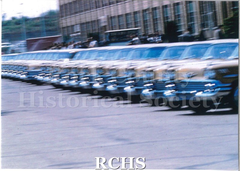 Color photo of 1958 Biscayne anniversary cars lined up.