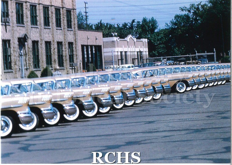 Color photo of 1958 Biscayne anniversary cars lined up.
