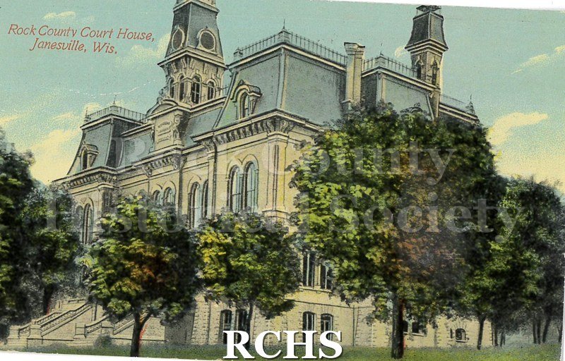 Postcard. Tinted image of the Rock County Court House. Addressed to Cornilie Jacobson of Edgerton. Postmarked 30 June 1911. Message written in black ink: "Rec.
