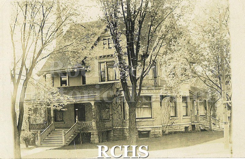 Postcard. Black and white photograph of a large home in Janesville. Address is unknown. Same home in 1979.14.138. Possibly the home of Dr. James Mills?