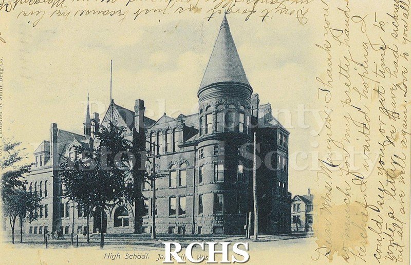 Postcard. Black and white image of Janesville High School. Addressed to Mrs. William Menzies of Janesville. Postmarked 6 February 1907.