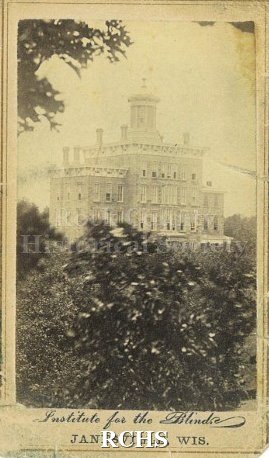 Carte-de-visite. Black and white photograph of the main building at the Institute for the Blind in Janesville from sometime prior to 1866.