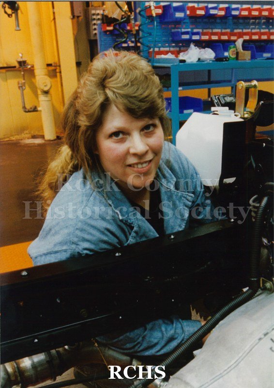 Color photo of Rose Wulff, an employee at Janesville General Motors, working on the Isuzu line.