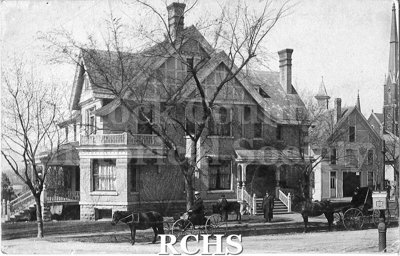 Postcard. Black and white photograph of a large home in Janesville. Sticker on the back reads James Mills, M.D., Janesville, Wis. Possible it was his home?